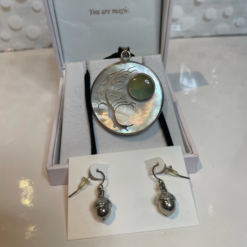 sterling silver and mother of pearl "Tree of Life" pendant with a green gemstone